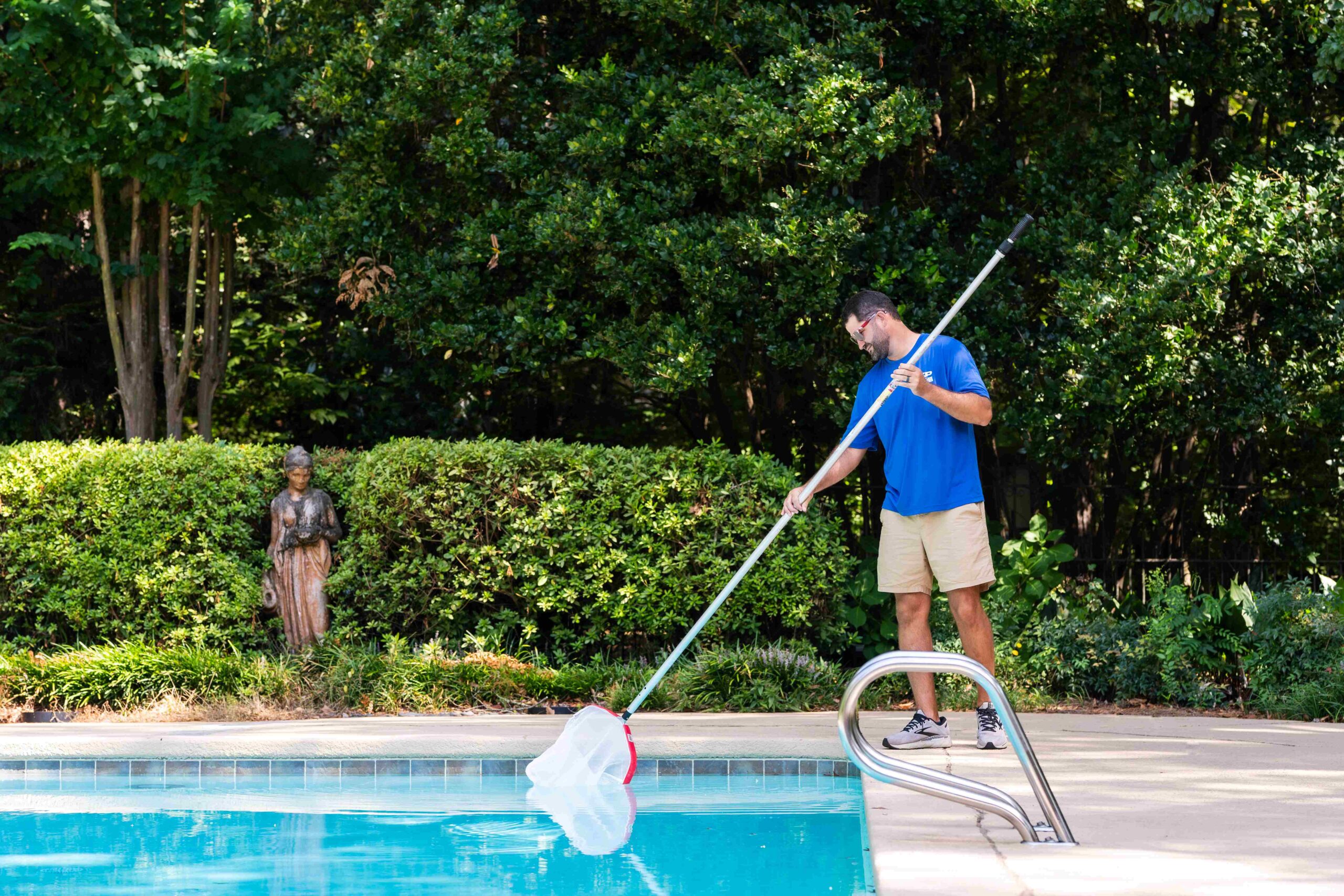 ASP franchise owner cleaning swimming pool